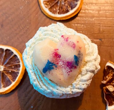 A bath bomb with slices of dried lemon