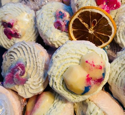 A selection of energy bath bombs with a slice of dried lemon